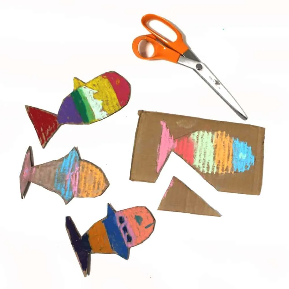 cutting cardboard fish kids craft - ocean kid craft - crafts for kids- kid crafts - acraftylife.com #preschool