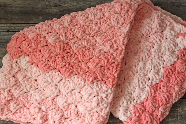 Try this easy shell stitch baby blanket crochet pattern. There is a free PDF pattern available, plus a video tutorial.