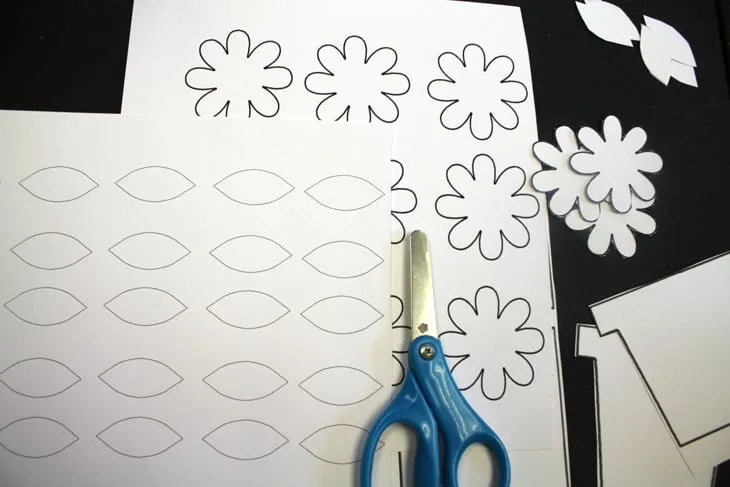 Make an easy paper flower craft. There is a free flower template. This craft needs just a few supplies.