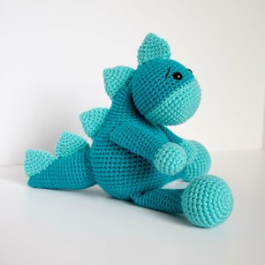 Make your own cute crochet dinosaur with this fun pattern.