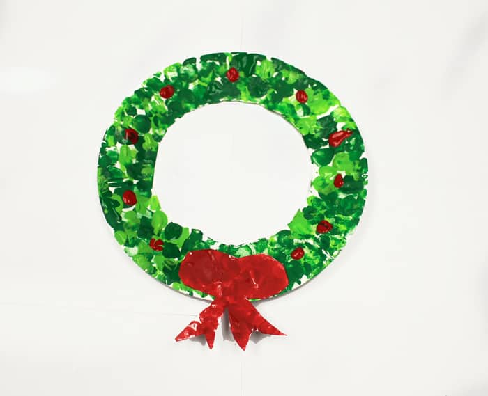 Try this fun and easy Christmas wreath craft for kids. You need a paper plate and some paint.