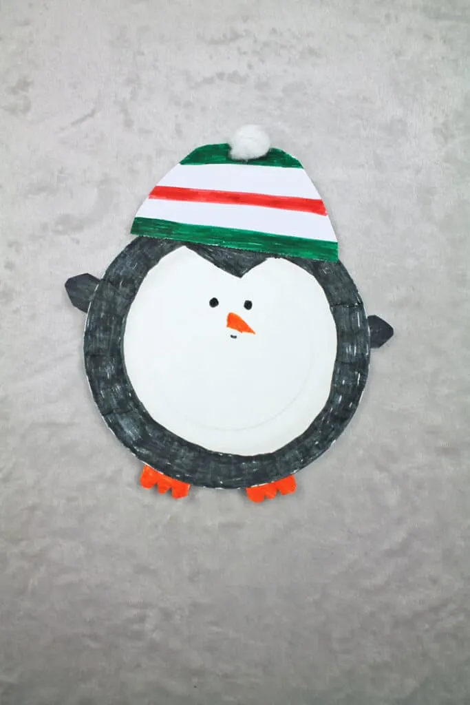 Make an easy paper plate penguin craft. This fun ornament needs just a few supplies.