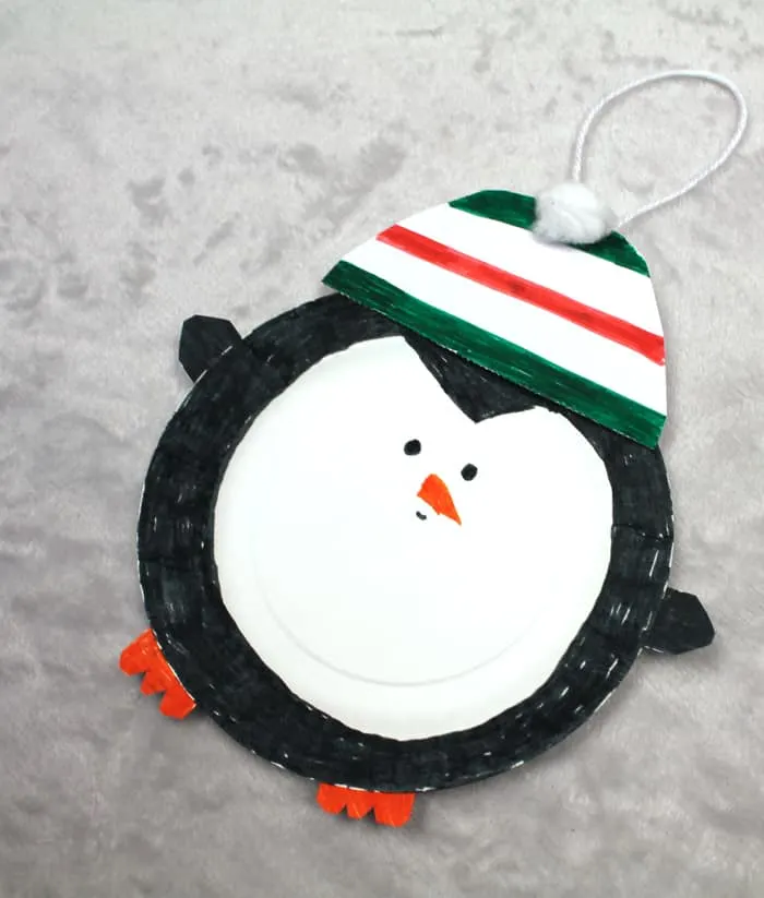 Make an easy paper plate penguin craft. This fun ornament needs just a few supplies.