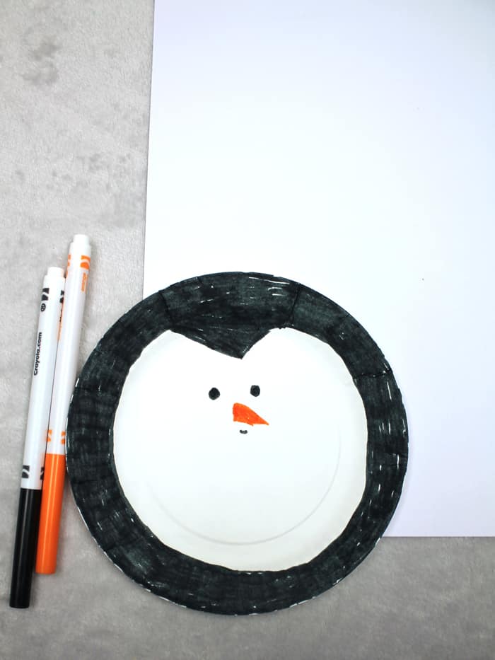 Make an easy paper plate penguin craft. This fun ornament needs just a few supplies.