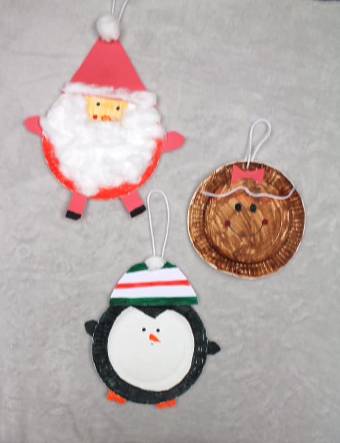 Paper ornament crafts for kids, gingerbread man, penguin, and Santa.
