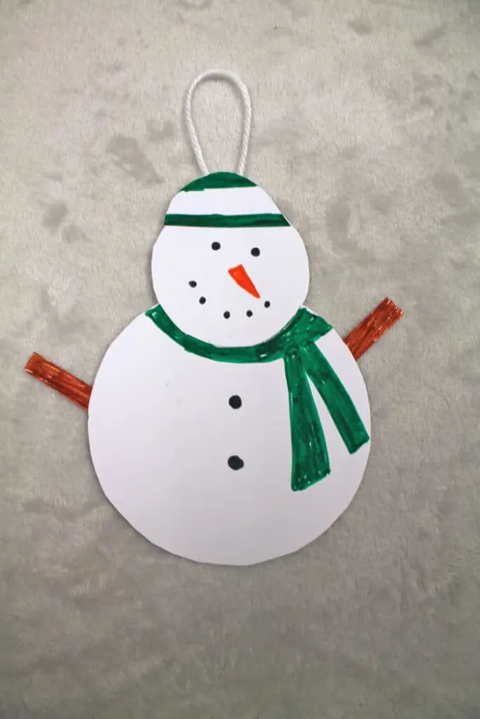 Make a fun and easy paper snowman ornament craft for kids.