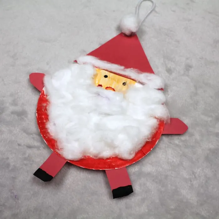 Make a santa paper plate ornament with this easy craft for kids.