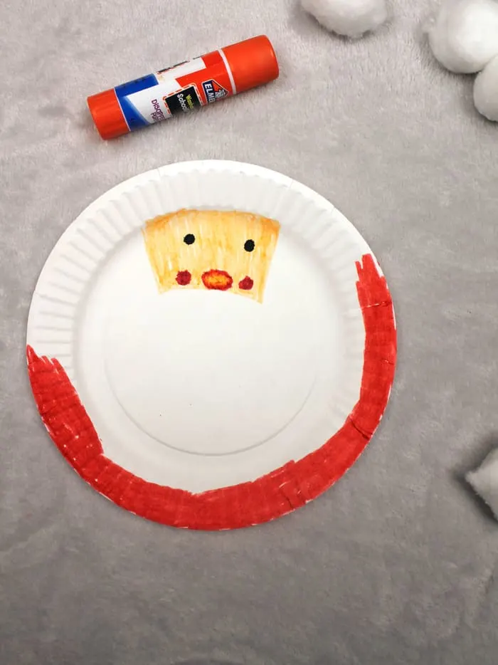 Make a paper plate Santa ornament Christmas craft.