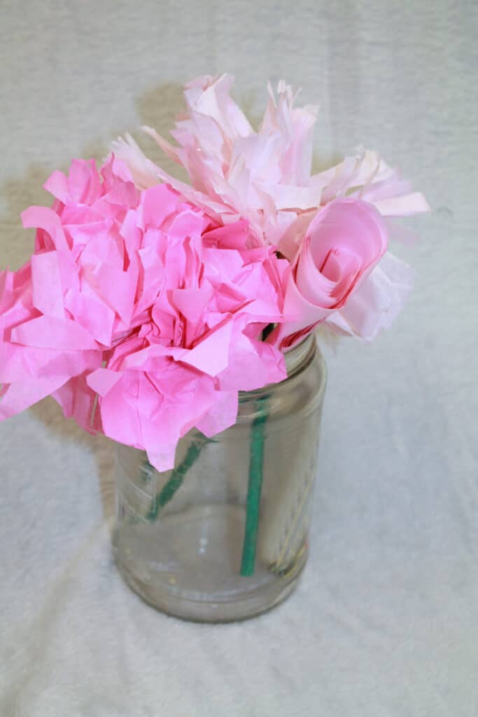 Learn how to make fun tissue paper flowers with this easy craft. This craft needs just a few supplies.