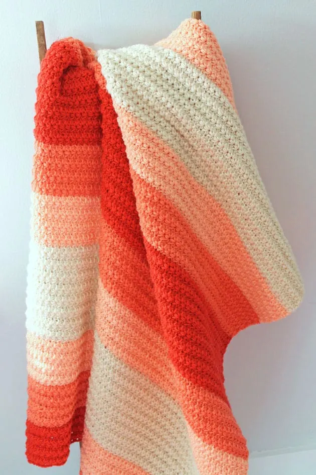Try this easy crochet blanket pattern. This throw blanket uses the star stitch.