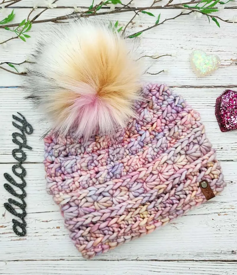 Learn how to make this winter hat using super chunky yarn. This crochet hat pattern works up quickly.