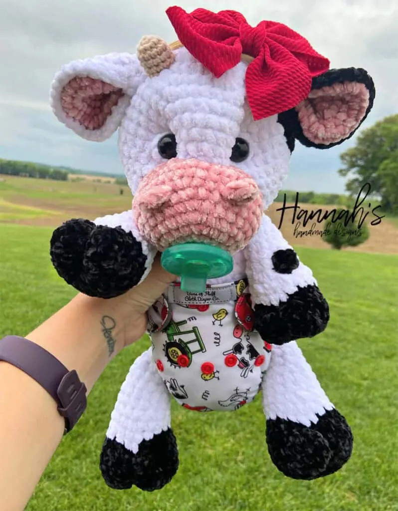 Make a soft and cuddly baby crocheted cow.