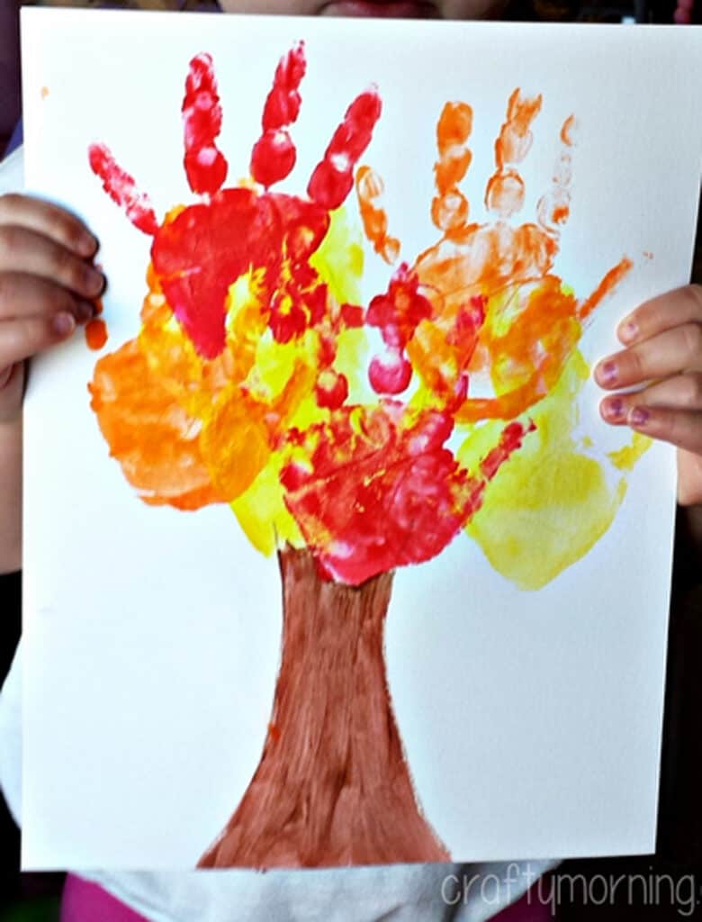 Paint your hand in fall colors and make this handprint tree craft for kids.
