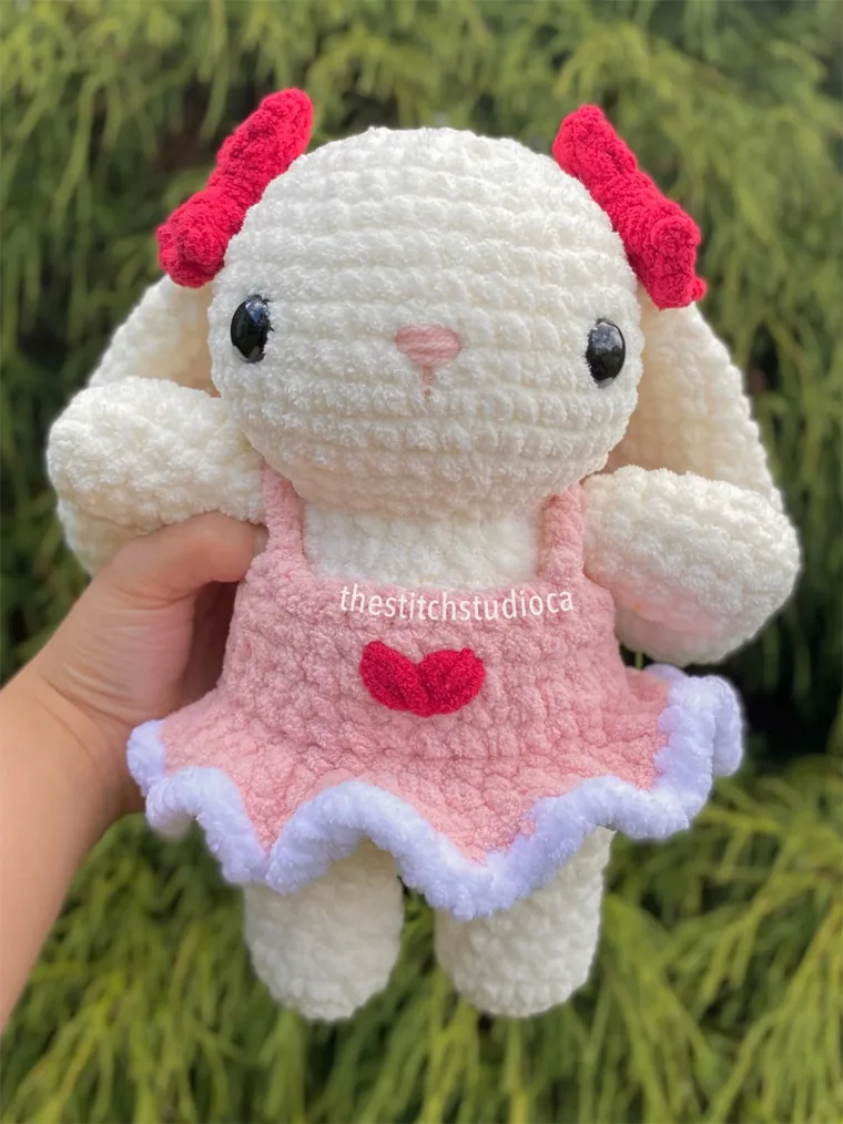 crocheted bunny plushie with dress.