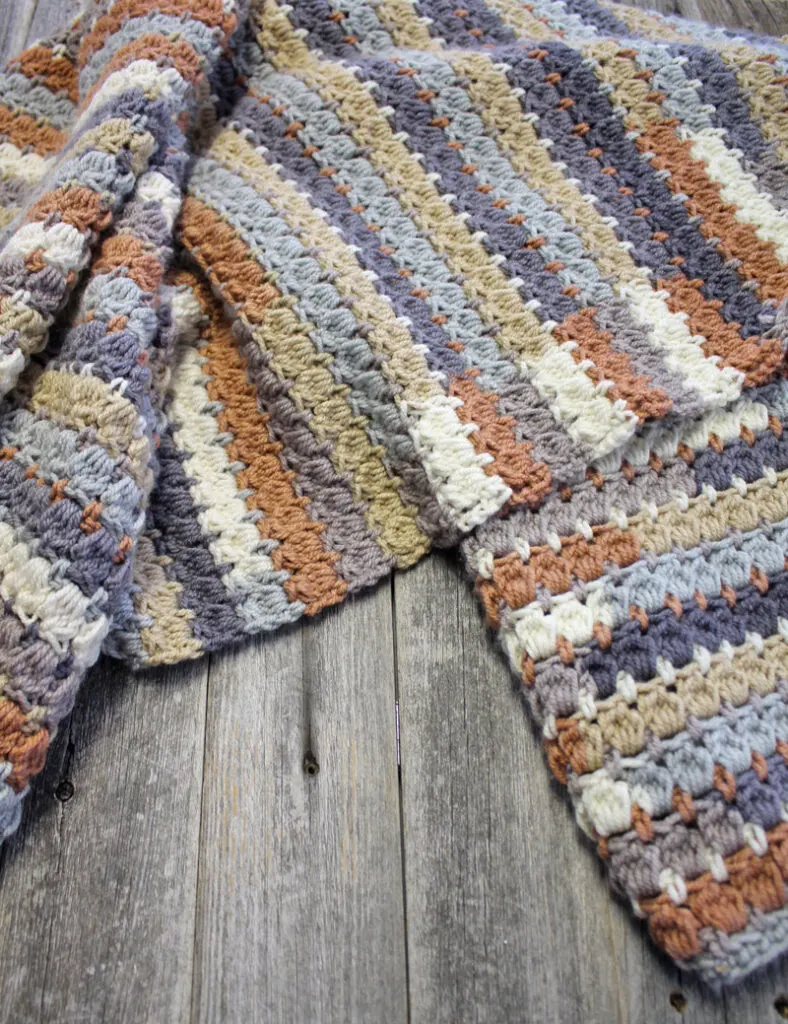  striped gray and brown crocheted throw blanket