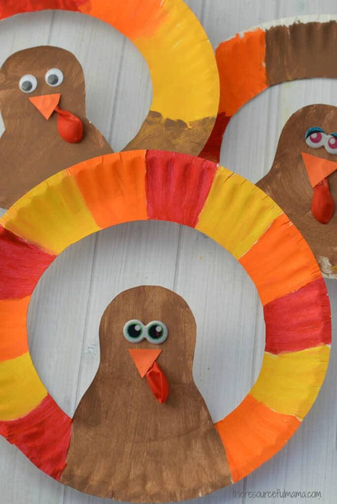 Paint a paper plate and turn it into a colorful turkey craft.