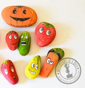 rocks painted to look like vegetables with faces